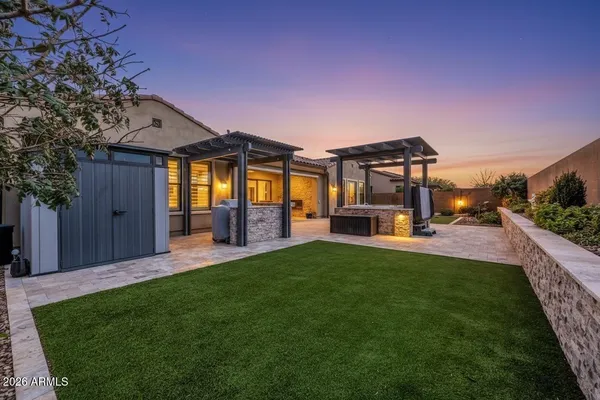 a view of an house with backyard porch and patio
