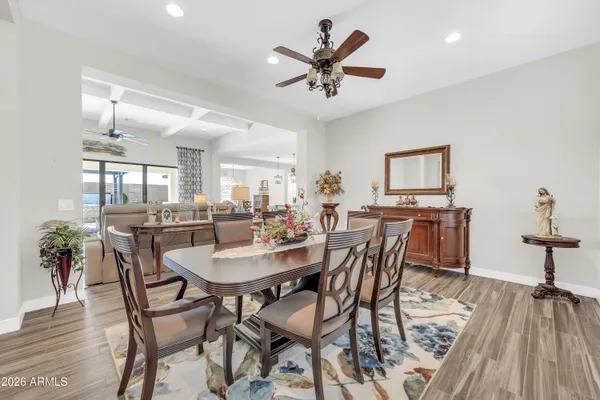 a view of a dining room with furniture and wooden floor