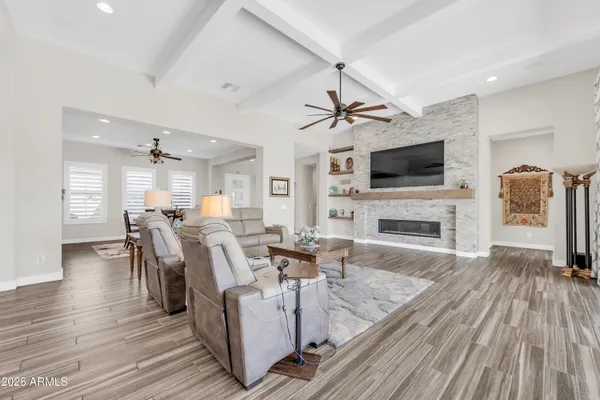 a living room with fireplace furniture and a flat screen tv