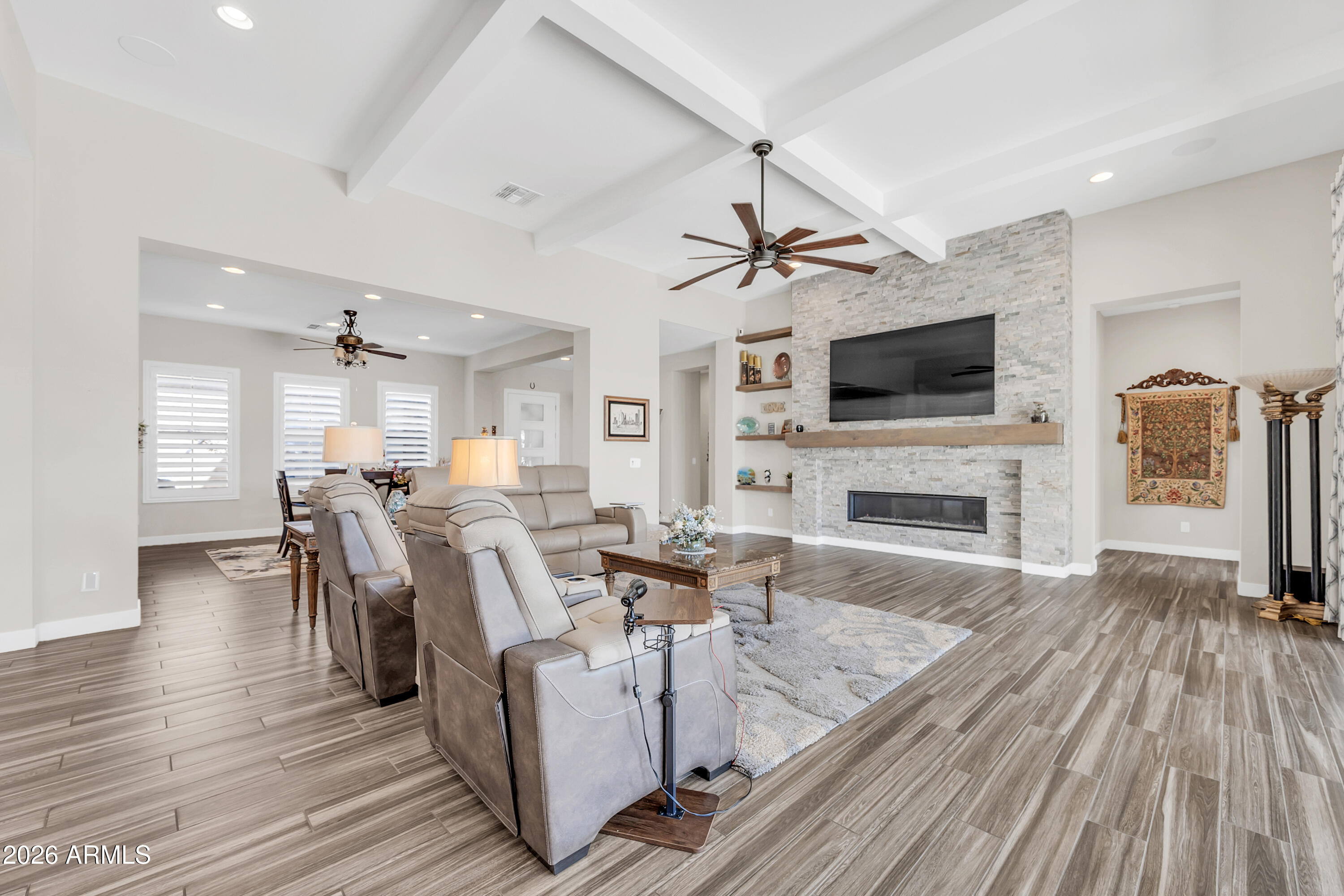 1867 East Gillcrest Road Gilbert, AZ 85298 - Photo 9 of 48 a living room with fireplace furniture and a flat screen tv