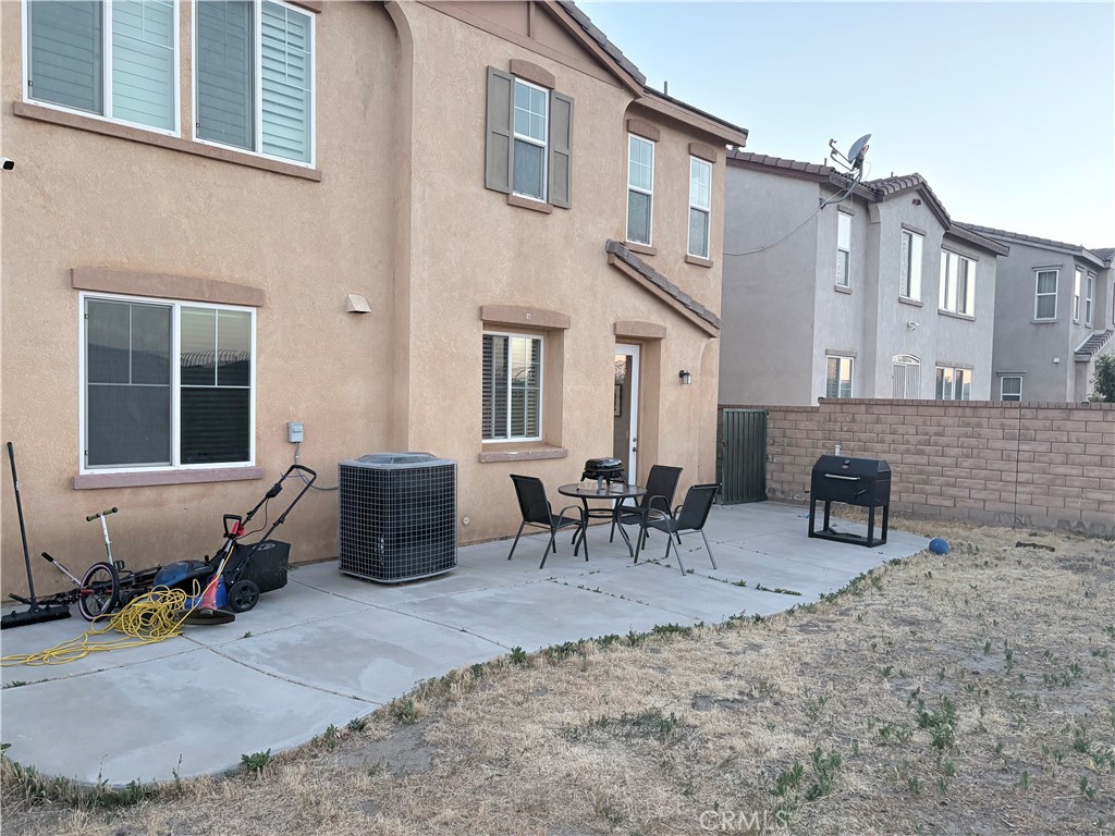 2729 Hornbeam Road Palmdale, CA 93551 - Photo 2 of 35 a view of a building with table and chairs