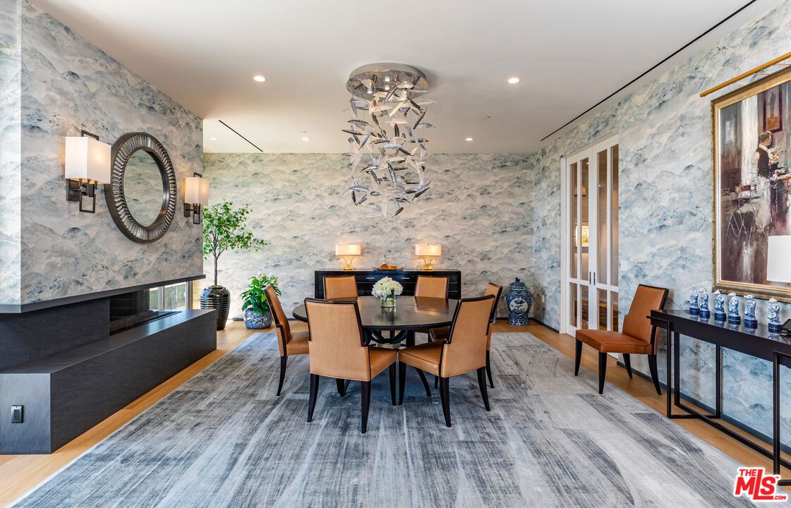 10601 Wilshire Boulevard, Unit 19E Los Angeles, CA 90024 - Photo 11 of 38 a view of a dining room with furniture window and wooden floor
