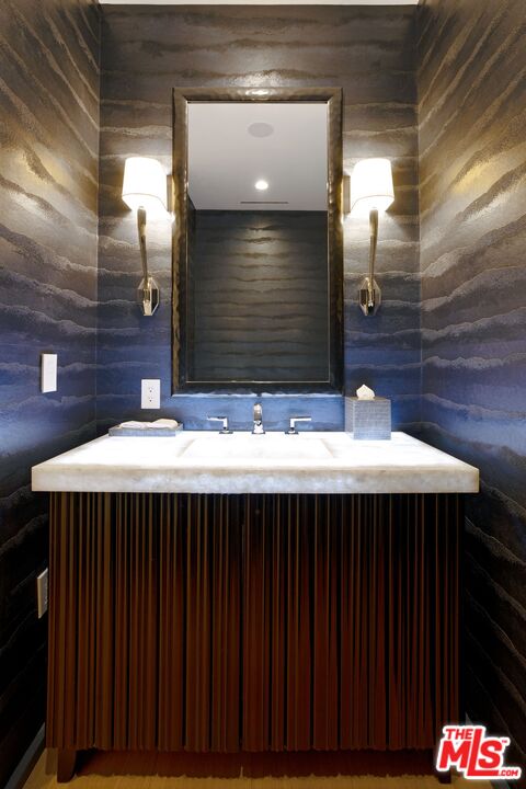10601 Wilshire Boulevard, Unit 19E Los Angeles, CA 90024 - Photo 20 of 38 a kitchen view with a sink and wooden floor