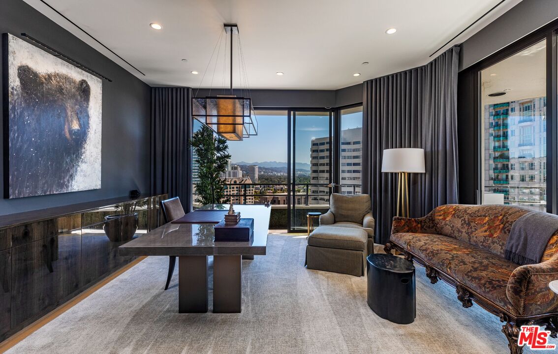 10601 Wilshire Boulevard, Unit 19E Los Angeles, CA 90024 - Photo 21 of 38 a living room with furniture and a large window