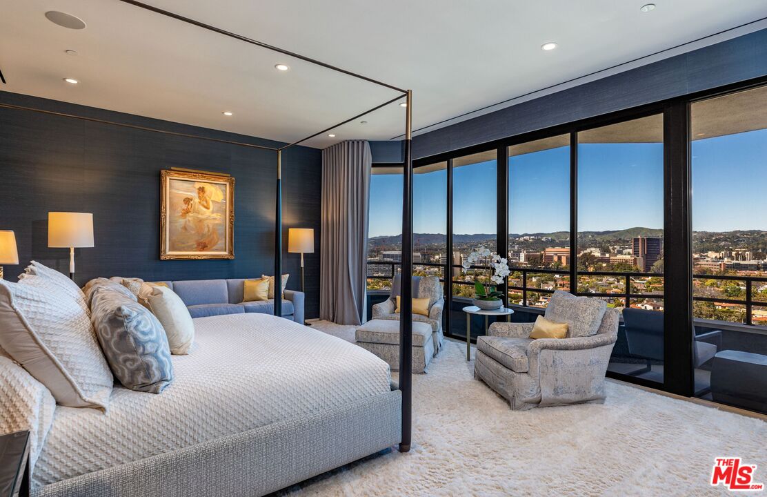 10601 Wilshire Boulevard, Unit 19E Los Angeles, CA 90024 - Photo 23 of 38 a bedroom with furniture and large windows