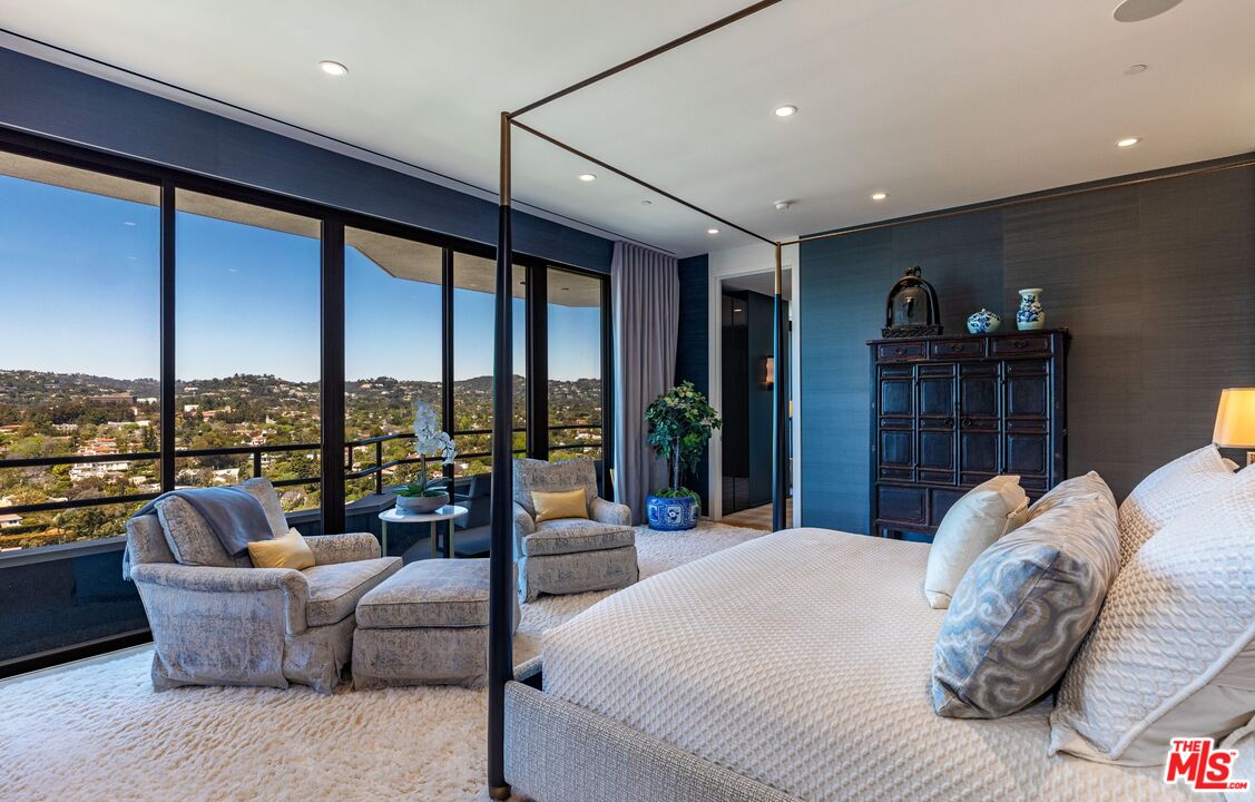 10601 Wilshire Boulevard, Unit 19E Los Angeles, CA 90024 - Photo 26 of 38 a living room with furniture large window and outer view