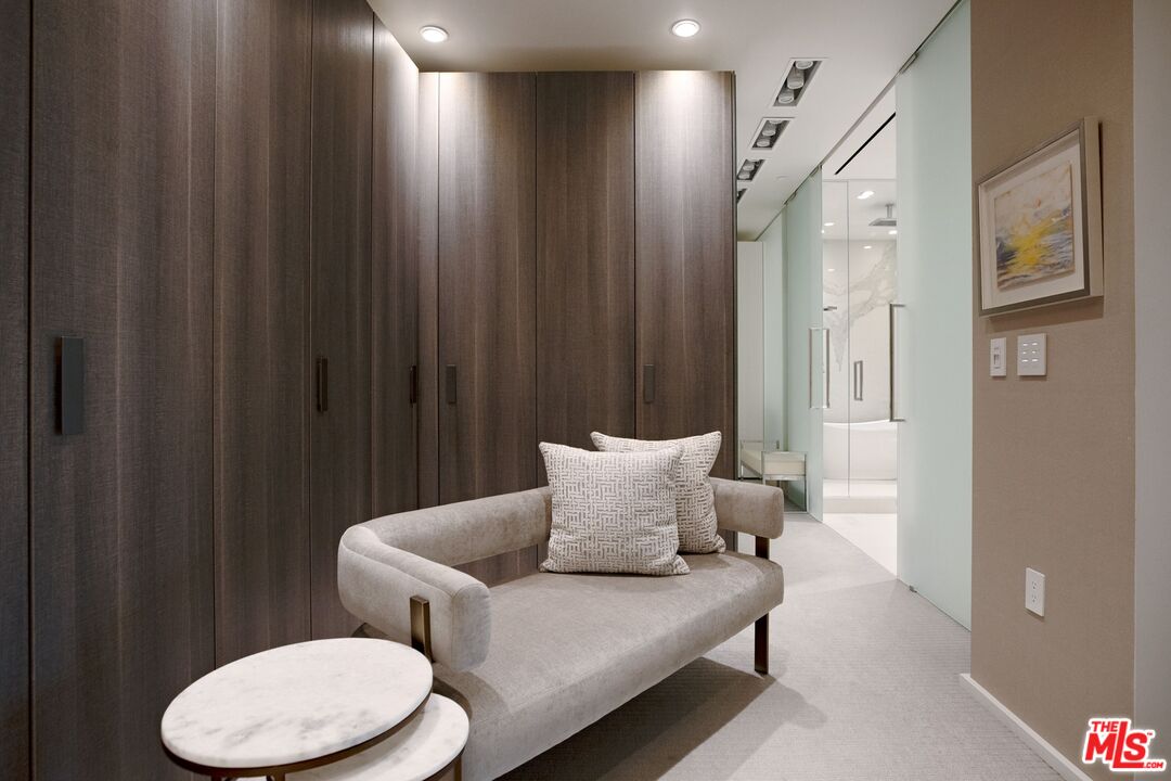 10601 Wilshire Boulevard, Unit 19E Los Angeles, CA 90024 - Photo 30 of 38 a hotel room with furniture and a potted plant