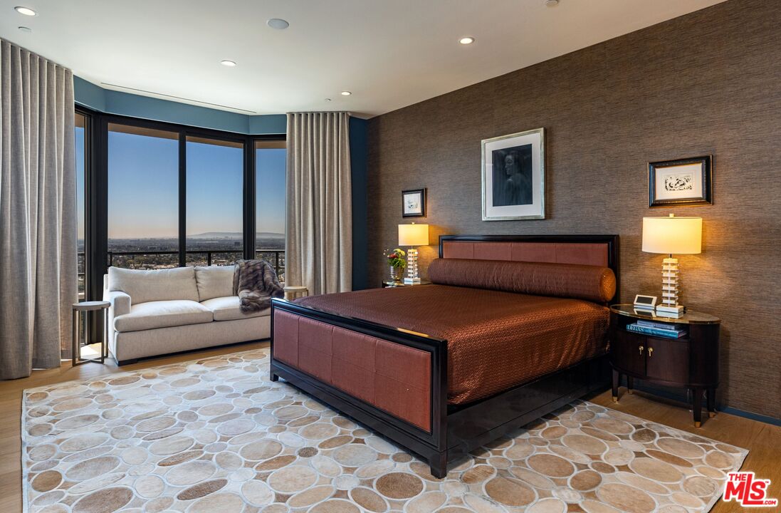 10601 Wilshire Boulevard, Unit 19E Los Angeles, CA 90024 - Photo 32 of 38 a bedroom with a bed and window