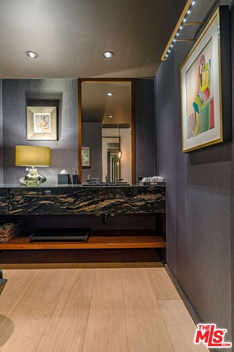 10601 Wilshire Boulevard, Unit 19E Los Angeles, CA 90024 - Photo 34 of 38 a large kitchen with stainless steel appliances a stove and a microwave