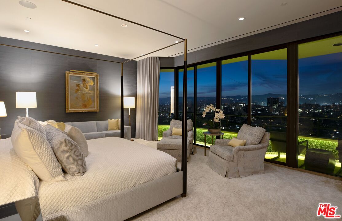 10601 Wilshire Boulevard, Unit 19E Los Angeles, CA 90024 - Photo 38 of 38 a bedroom with a bed and a couch