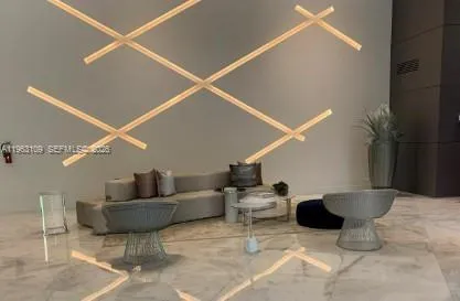 a living room with furniture and white walls