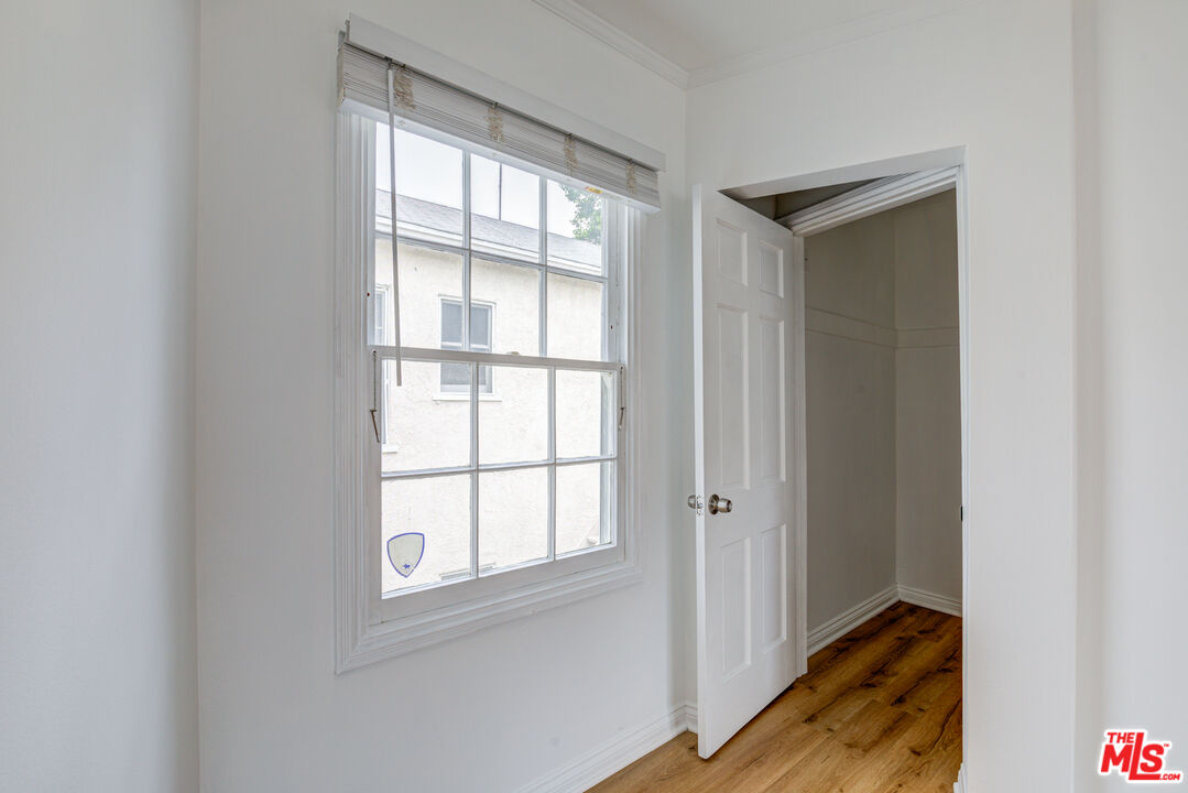 9643 Charleville Boulevard Beverly Hills, CA 90212 - Photo 12 of 21 a view of an empty room and window