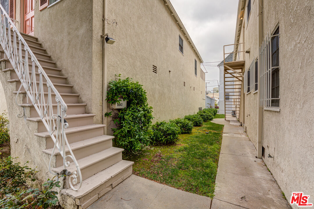 9643 Charleville Boulevard Beverly Hills, CA 90212 - Photo 20 of 21 a view of front door with potted plants