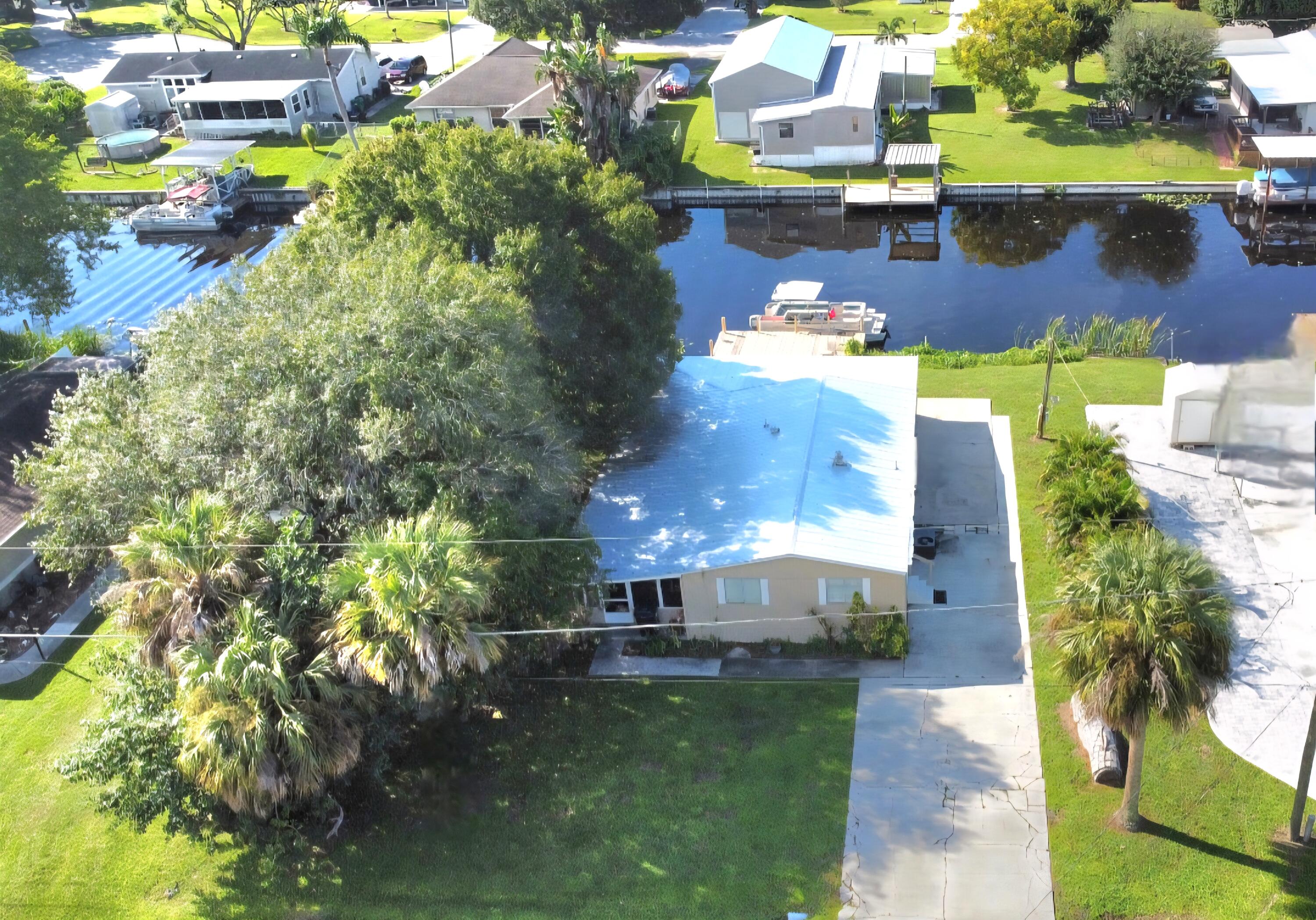 2612 Southeast 29th Street Okeechobee, FL 34974 - Photo 1 of 46 an aerial view of a house with a yard