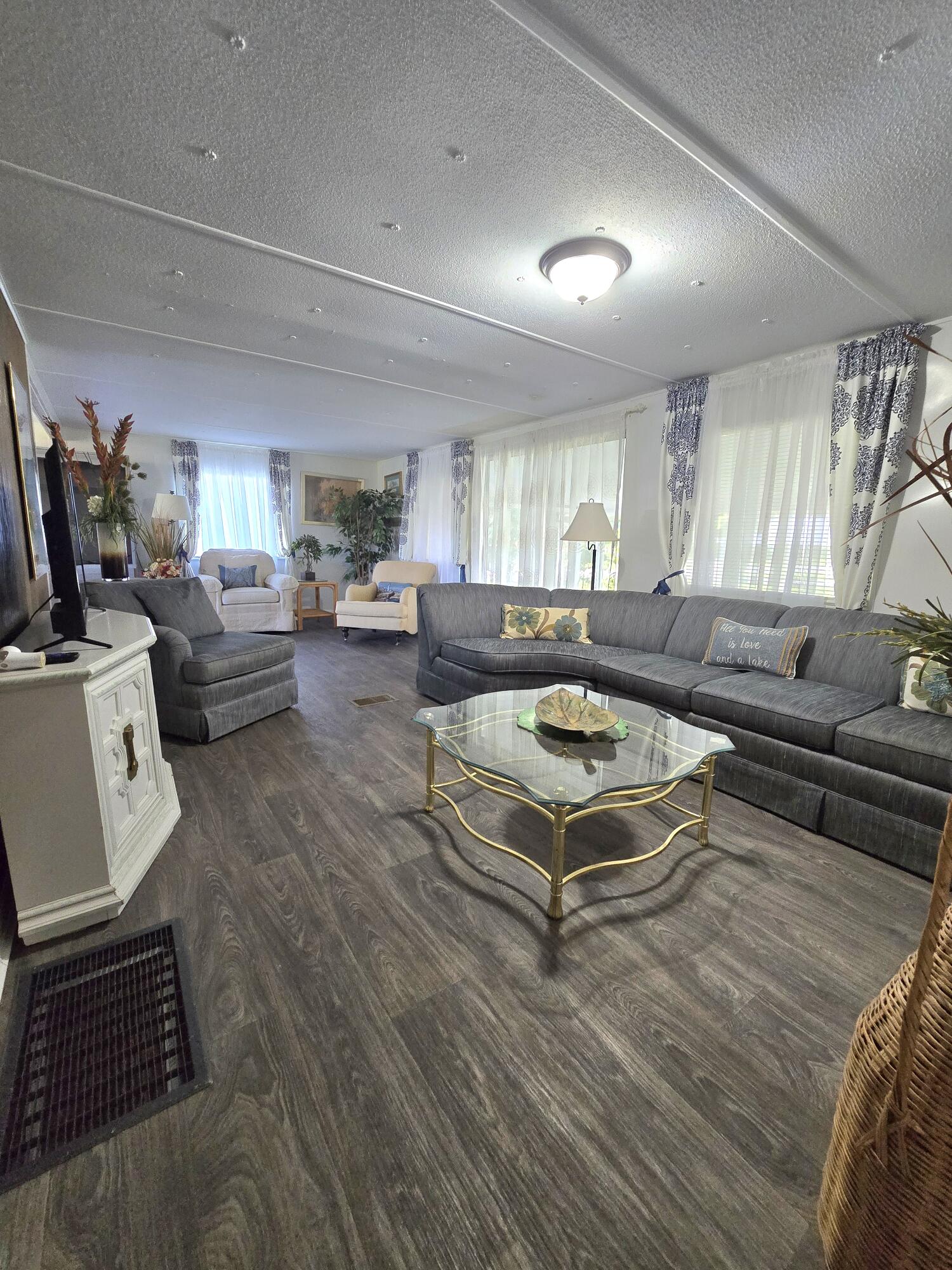 2612 Southeast 29th Street Okeechobee, FL 34974 - Photo 11 of 46 a living room with furniture and a rug