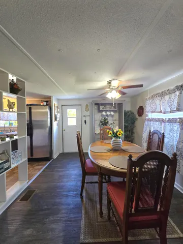 a dining room with furniture and window