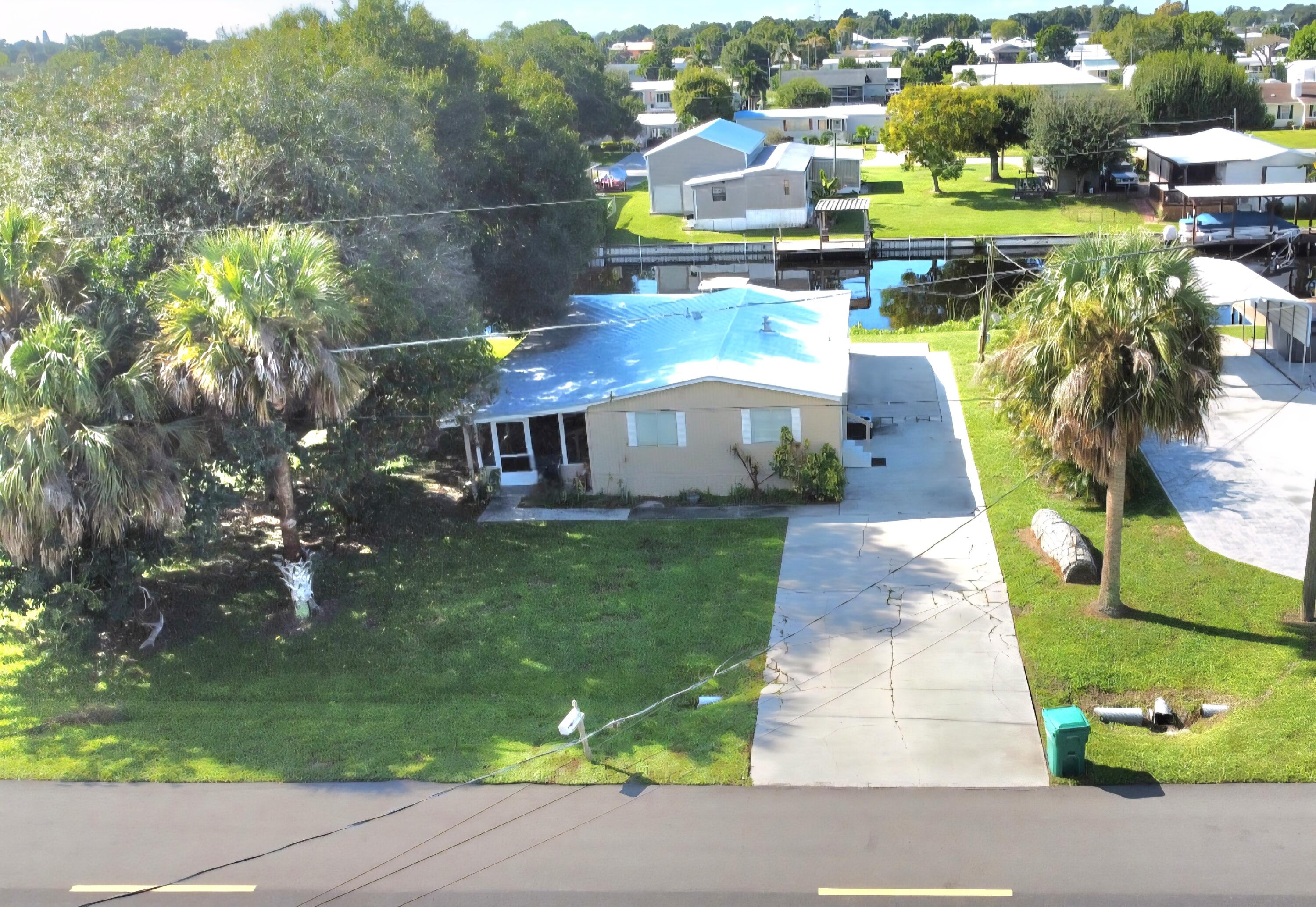 2612 Southeast 29th Street Okeechobee, FL 34974 - Photo 2 of 46 a view of a city with tall buildings