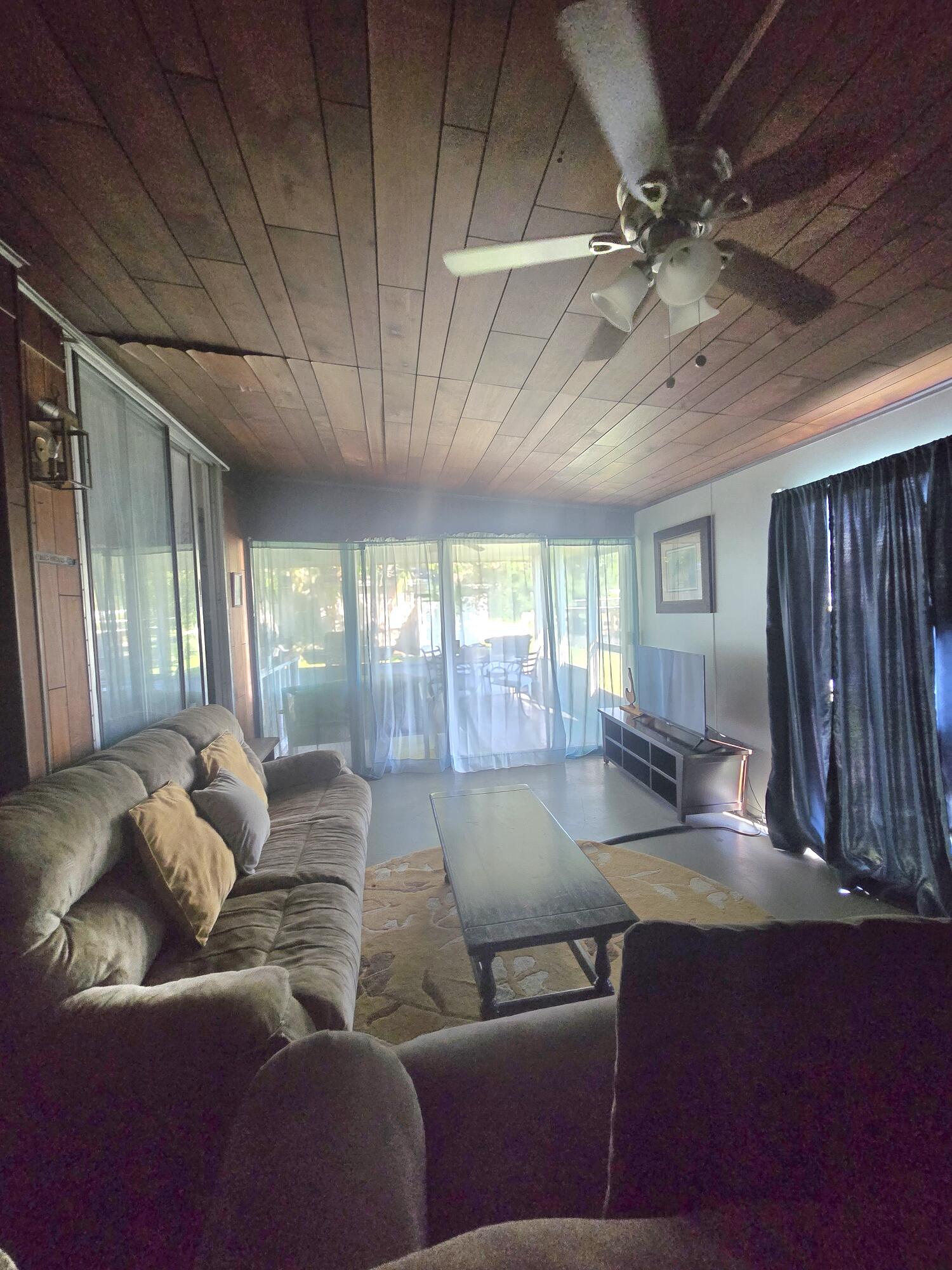 2612 Southeast 29th Street Okeechobee, FL 34974 - Photo 30 of 46 a living room with furniture and a large window