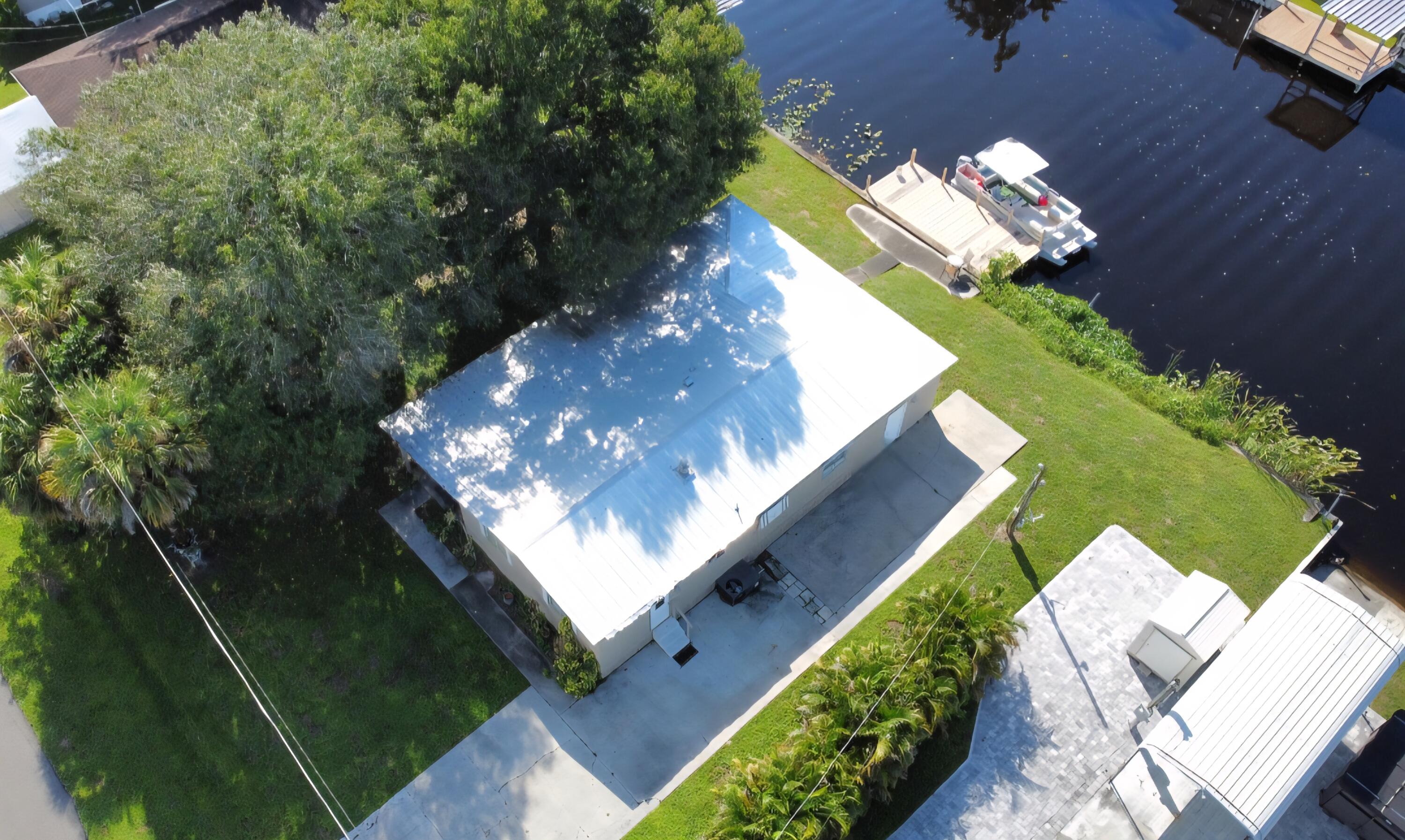 2612 Southeast 29th Street Okeechobee, FL 34974 - Photo 3 of 46 a view of a house with a yard