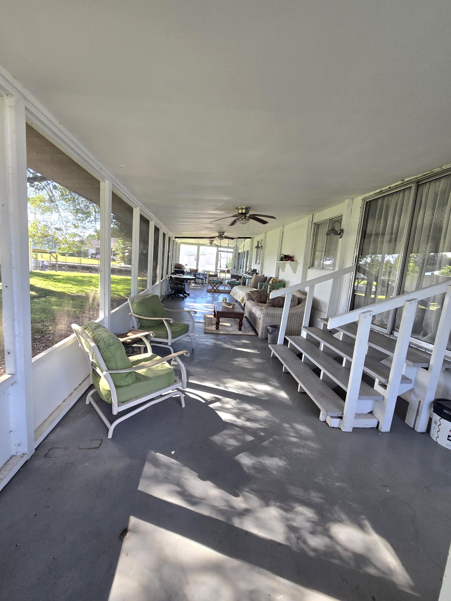 2612 Southeast 29th Street Okeechobee, FL 34974 - Photo 35 of 46 a living room with lots of furniture and a large window