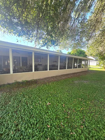 front view of a house with a big yard