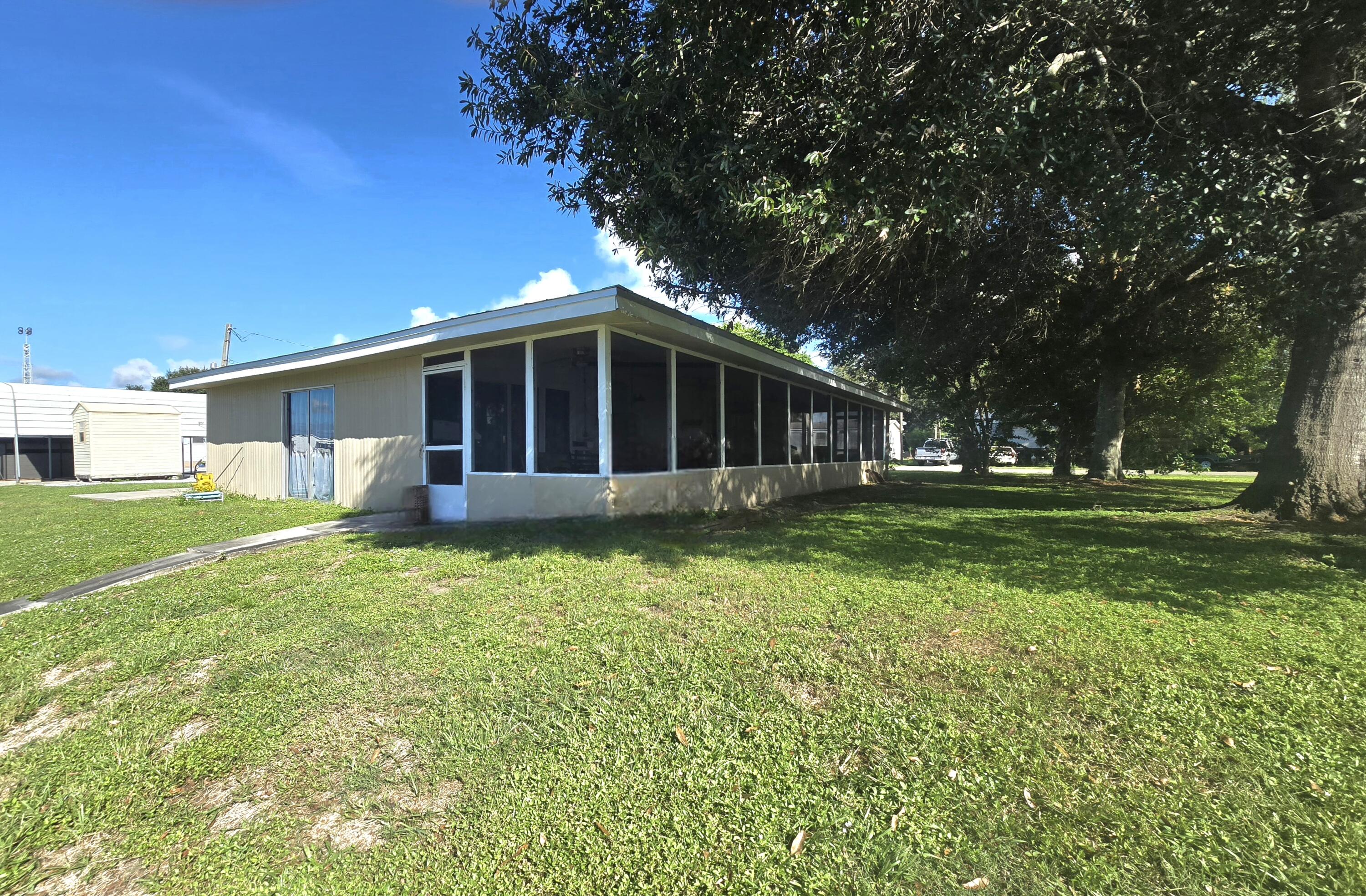 2612 Southeast 29th Street Okeechobee, FL 34974 - Photo 39 of 46 a view of a house with backyard and garden