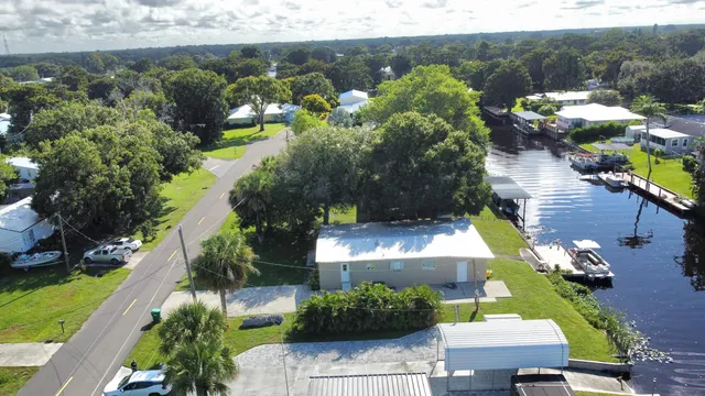 an aerial view of a house with a lake view