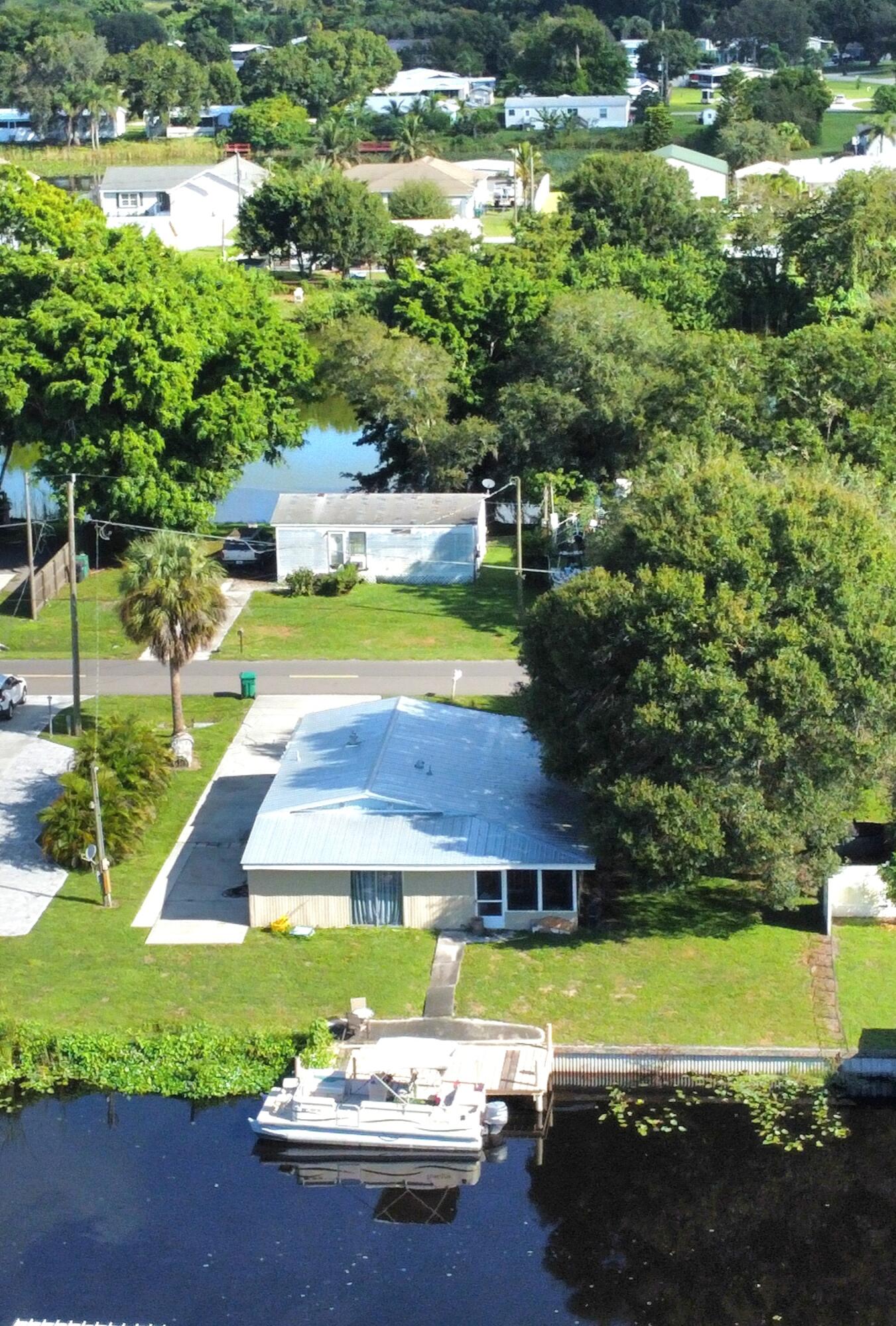2612 Southeast 29th Street Okeechobee, FL 34974 - Photo 8 of 46 a view of a swimming pool with a yard