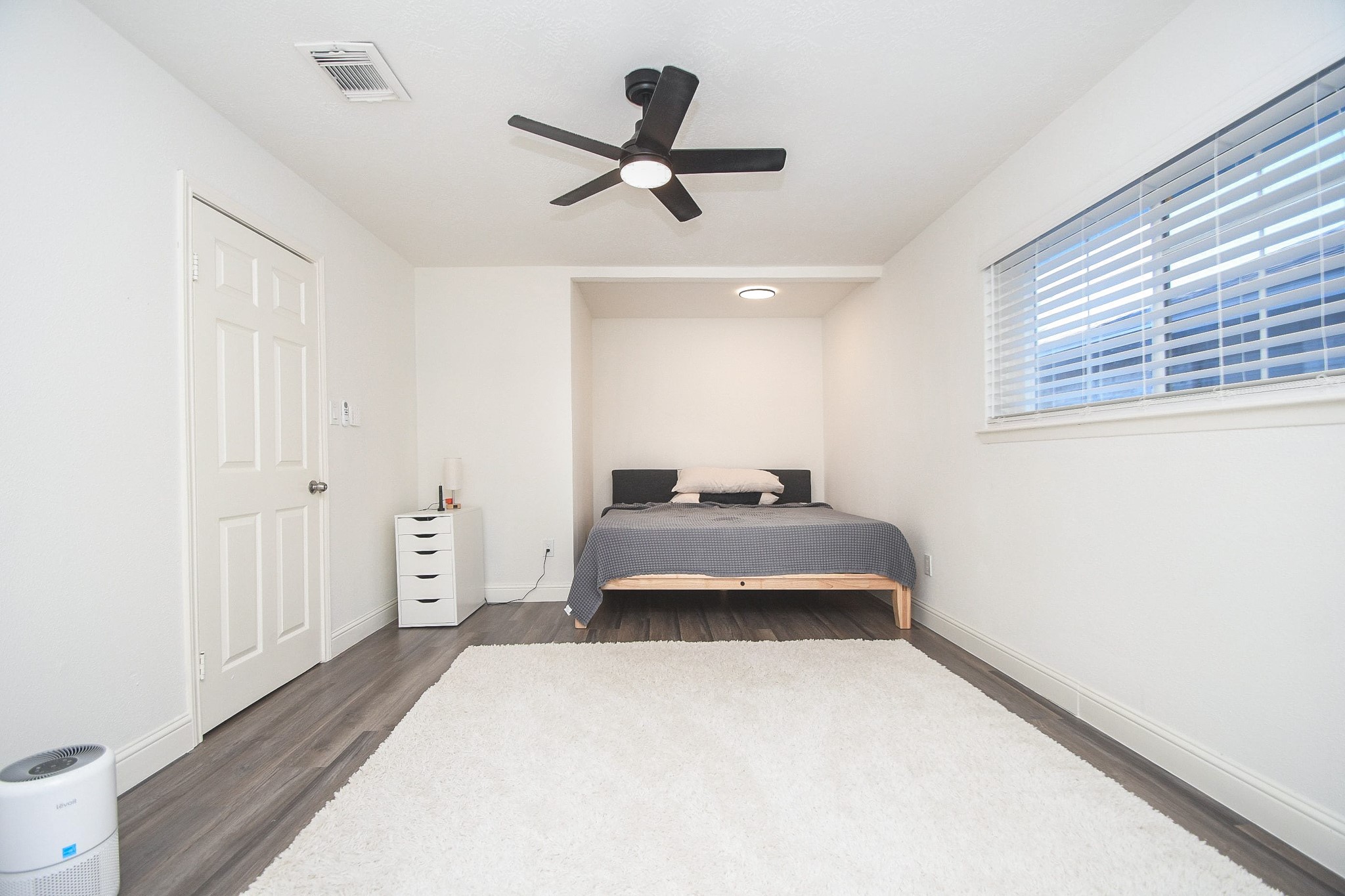 11443 Newbrook Drive Houston, TX 77072 - Photo 15 of 31 a bedroom with a bed and a window