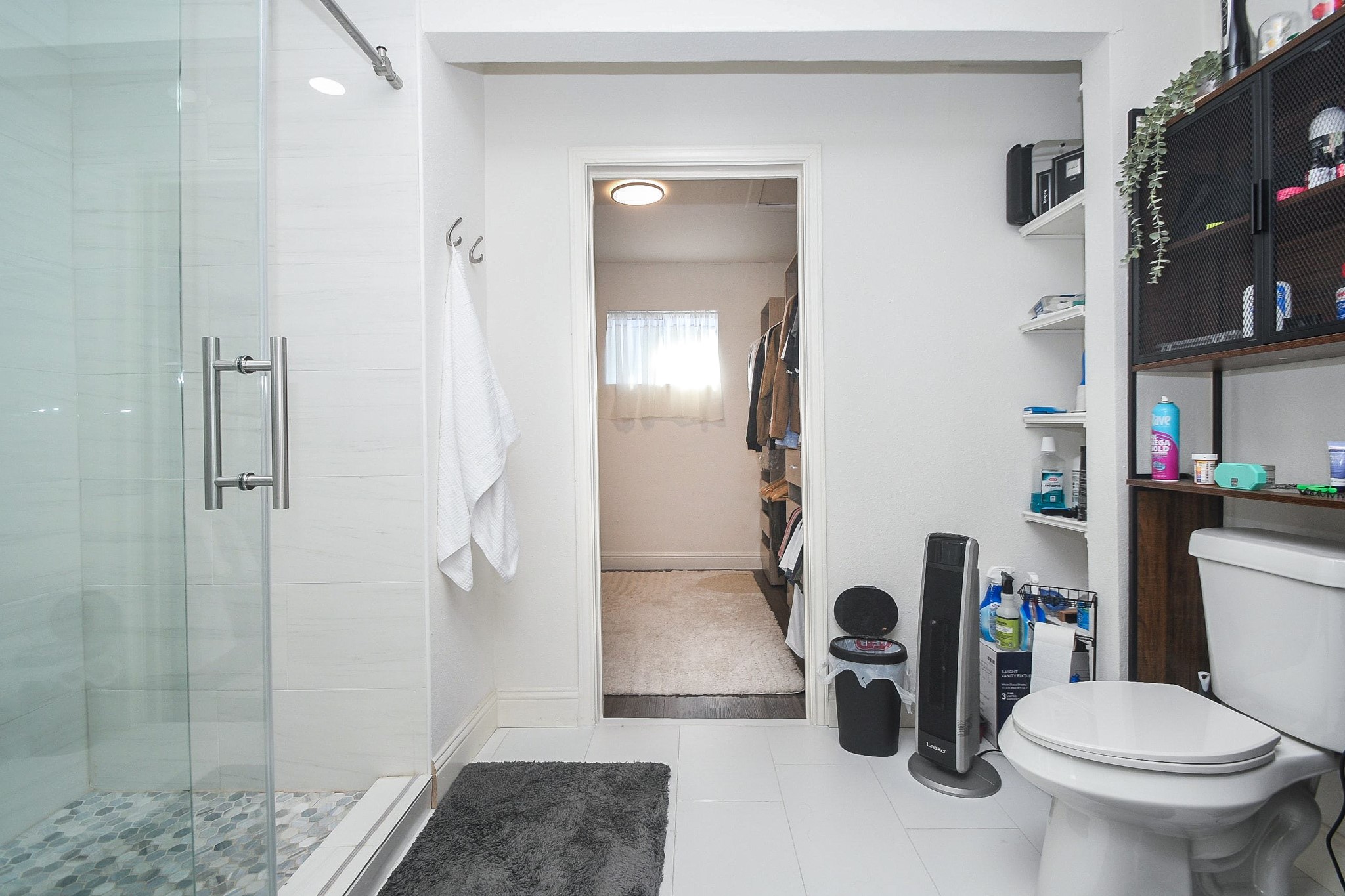 11443 Newbrook Drive Houston, TX 77072 - Photo 18 of 31 a bathroom with a toilet and a shower