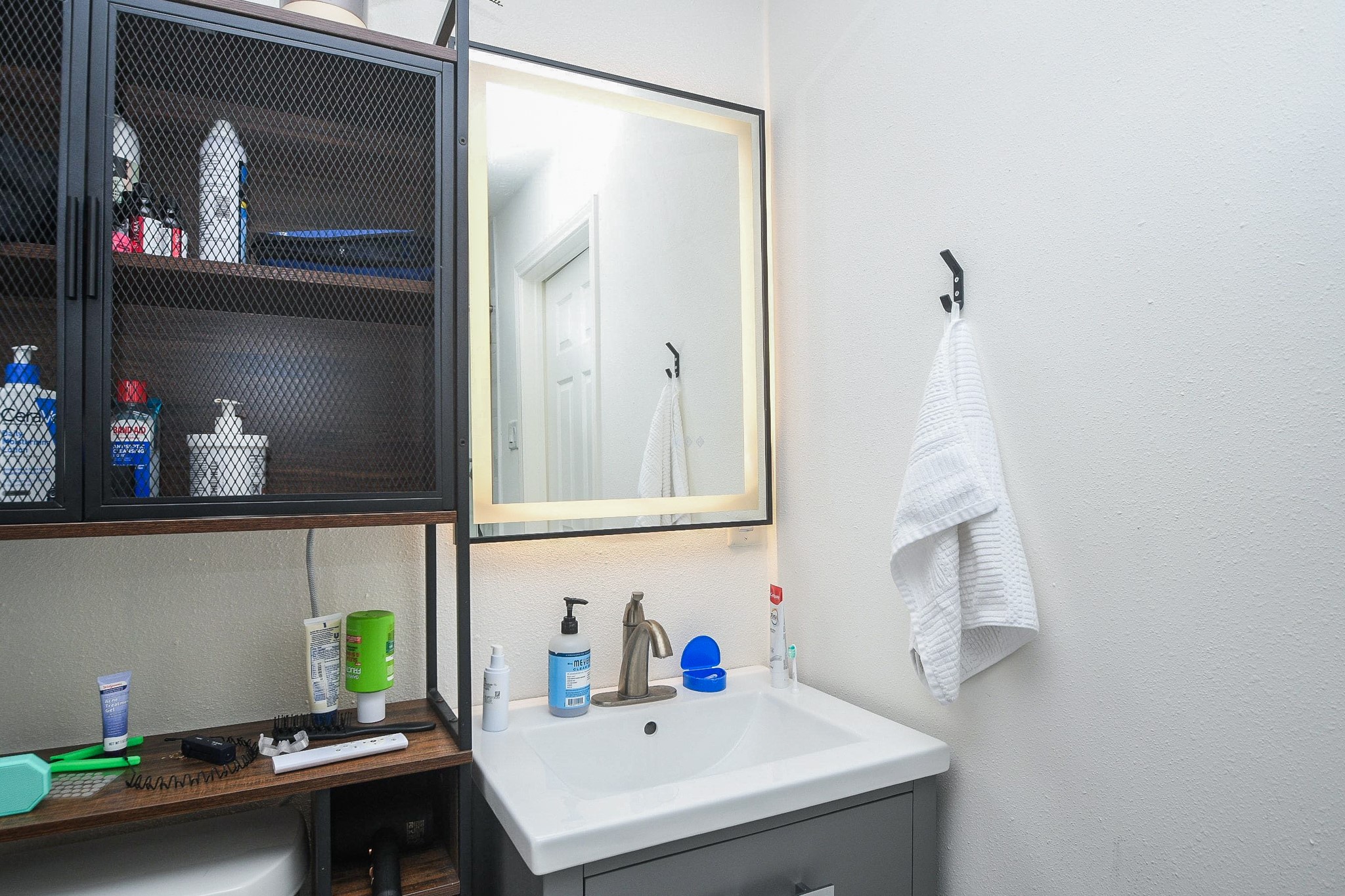 11443 Newbrook Drive Houston, TX 77072 - Photo 19 of 31 a bathroom with a sink and a mirror