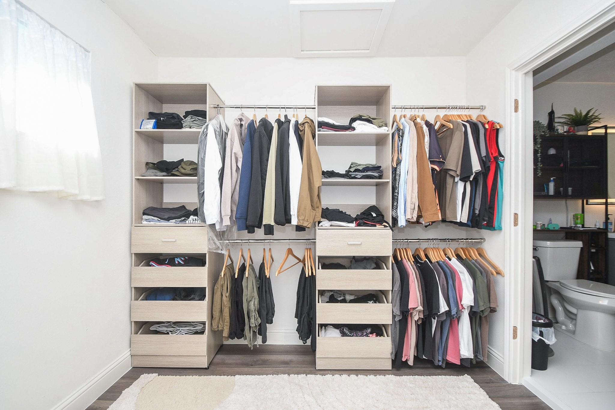 11443 Newbrook Drive Houston, TX 77072 - Photo 21 of 31 a view of walk in closet with clothes and shoes