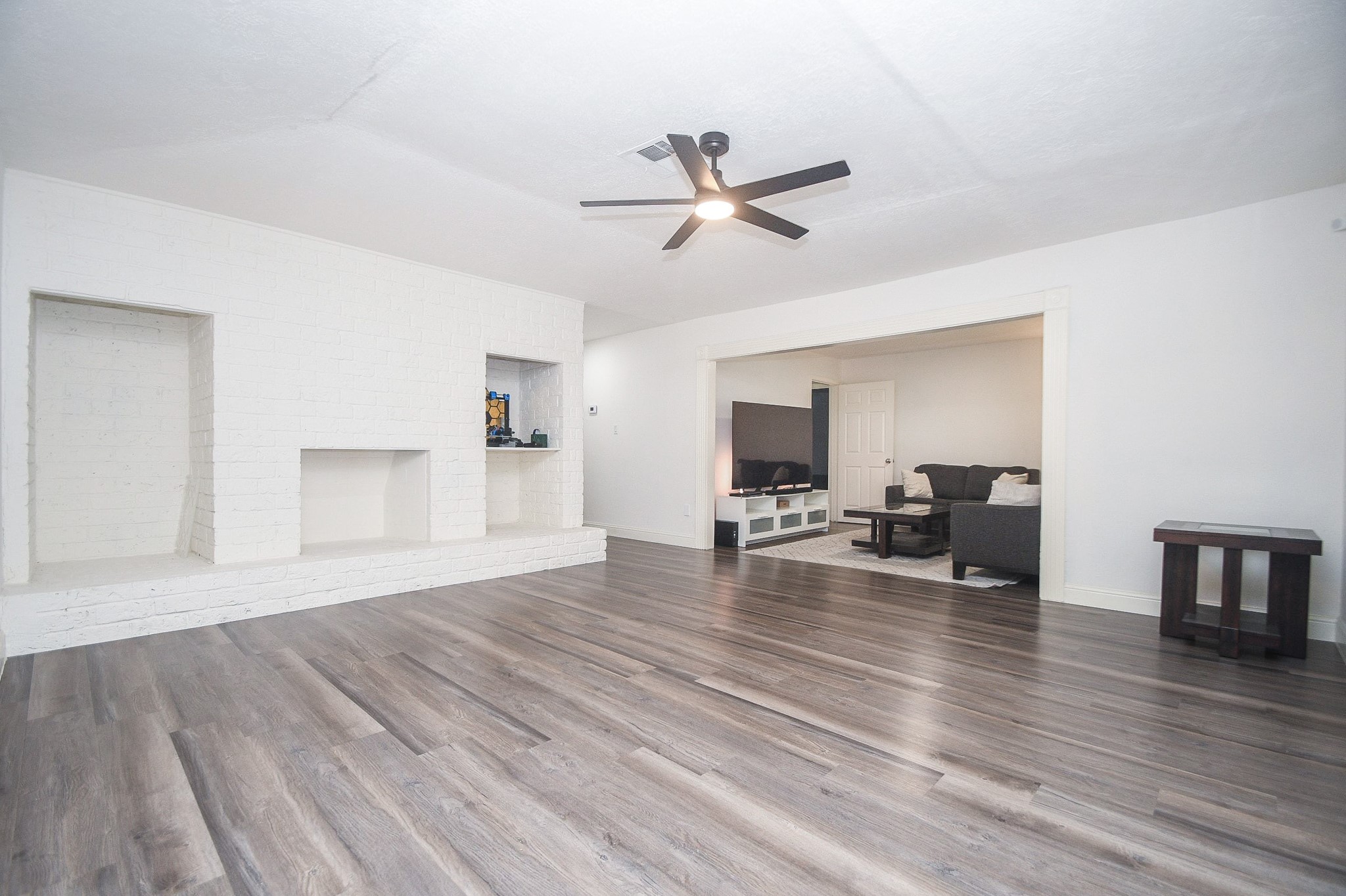 11443 Newbrook Drive Houston, TX 77072 - Photo 8 of 31 a living room with furniture and a wooden floor