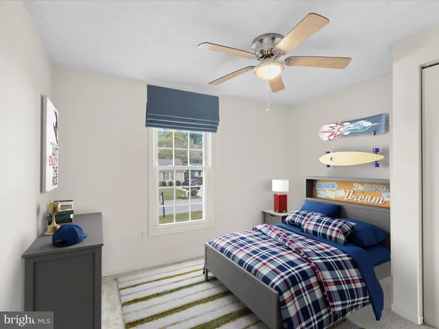 a bedroom with a bed and window