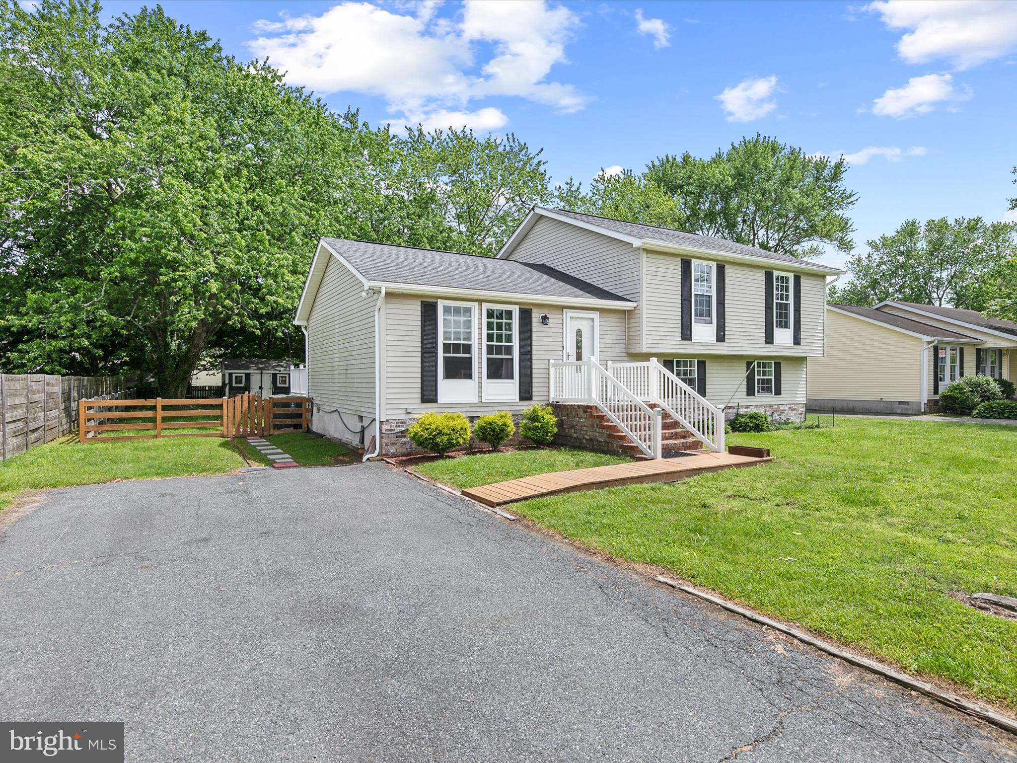 403 West Street Berlin, MD 21811 - Photo 2 of 34 a view of a house with a yard and plants