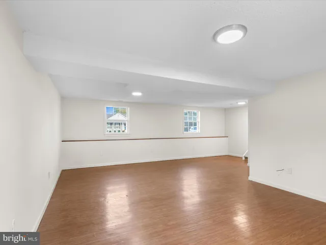 a view of a livingroom with wooden floor