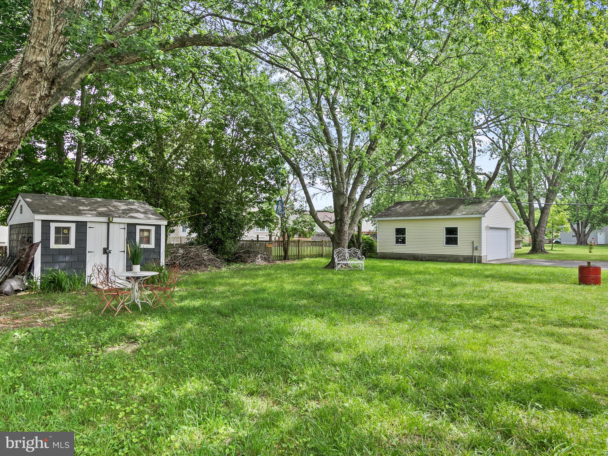 403 West Street Berlin, MD 21811 - Photo 26 of 34 a view of a yard in front of a house with large trees