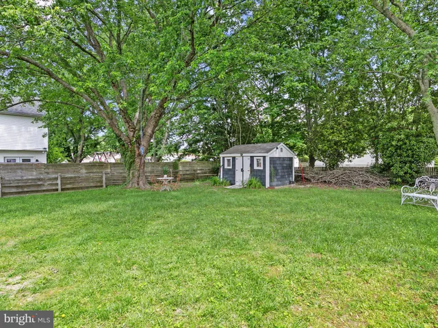 a view of a deck and a backyard