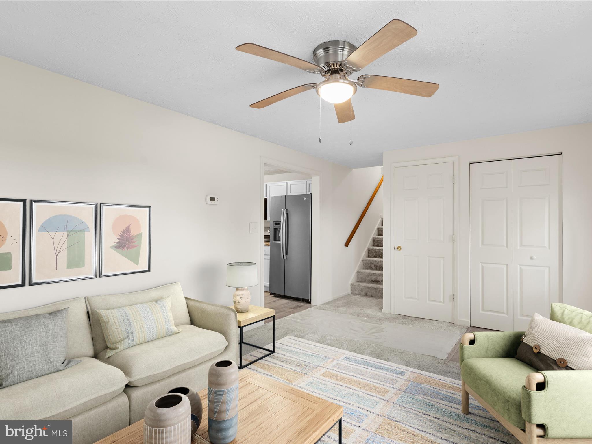 403 West Street Berlin, MD 21811 - Photo 4 of 34 a living room with furniture and a ceiling fan