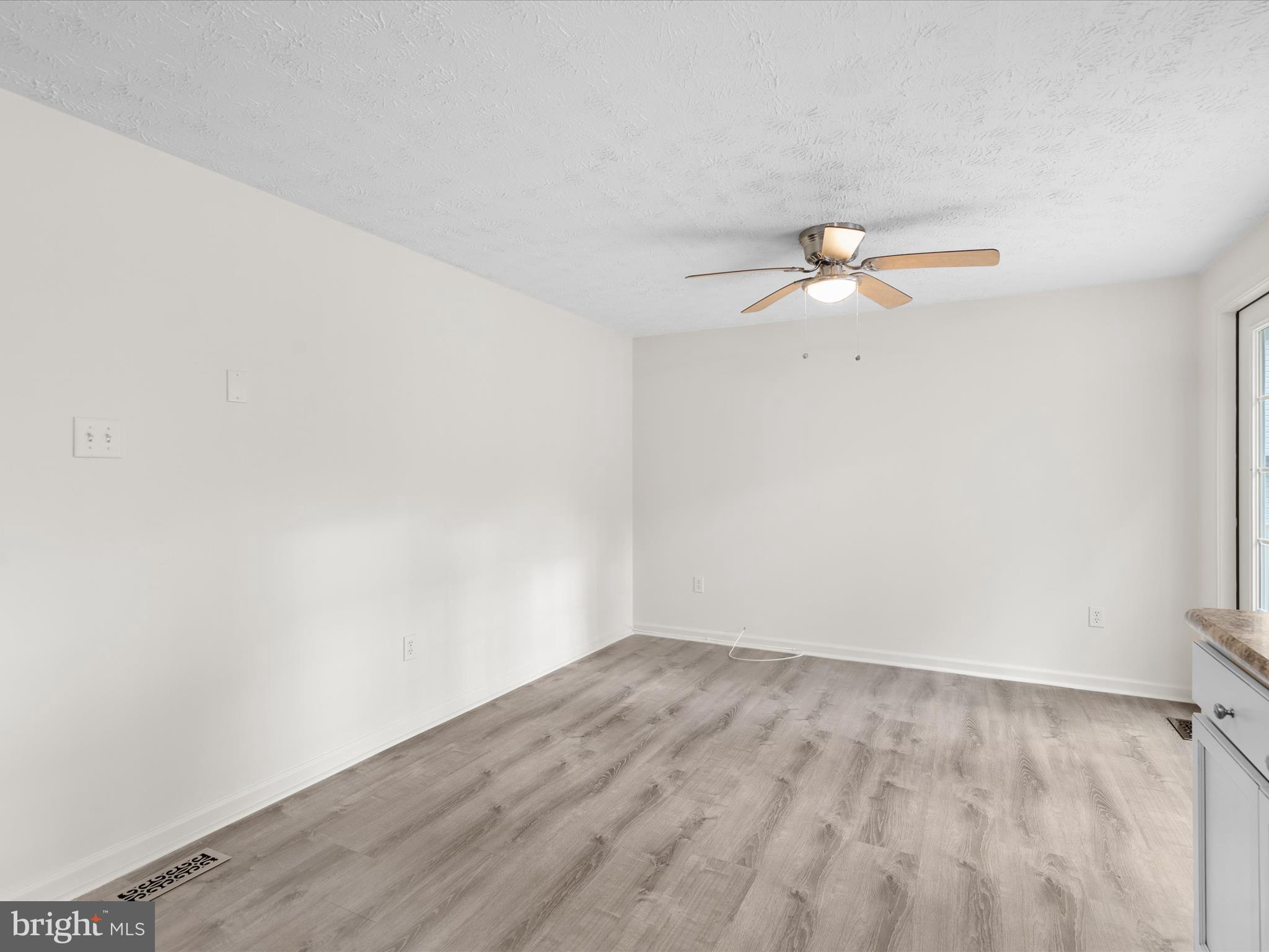 403 West Street Berlin, MD 21811 - Photo 9 of 34 a view of a room with wooden floor
