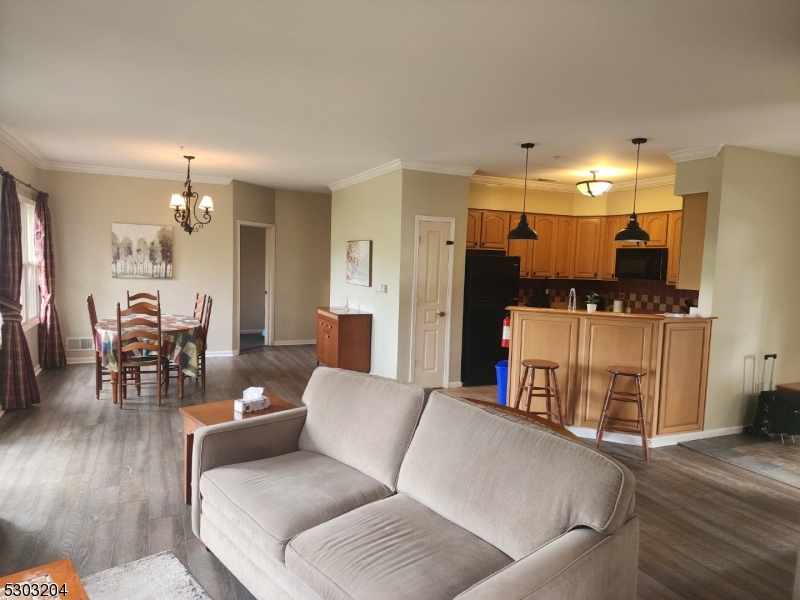 7 Maple Crescent, Unit 11 Vernon, NJ 07462 - Photo 13 of 42 a living room with furniture and a flat screen tv