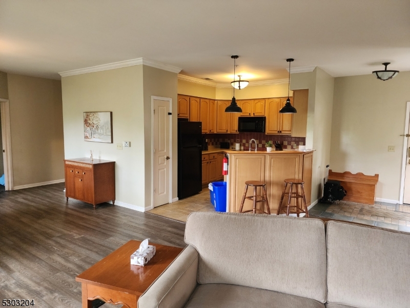 7 Maple Crescent, Unit 11 Vernon, NJ 07462 - Photo 14 of 42 a living room with furniture and a kitchen