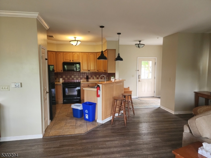 7 Maple Crescent, Unit 11 Vernon, NJ 07462 - Photo 18 of 42 a view of kitchen with furniture and wooden floor