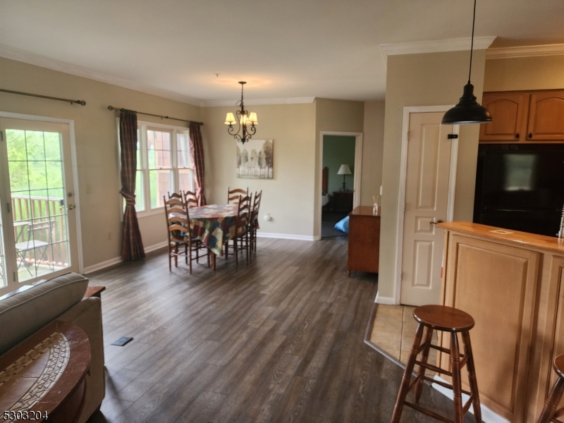 7 Maple Crescent, Unit 11 Vernon, NJ 07462 - Photo 2 of 42 a view of a dining room with furniture and chandelier