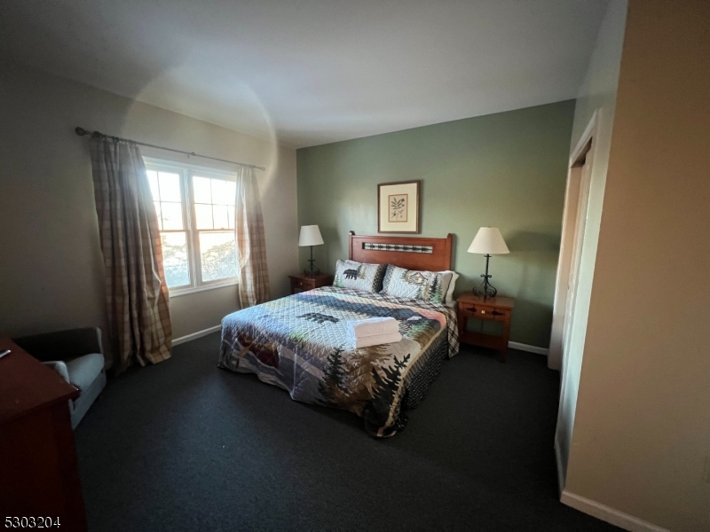 7 Maple Crescent, Unit 11 Vernon, NJ 07462 - Photo 21 of 42 a bedroom with a bed and a window