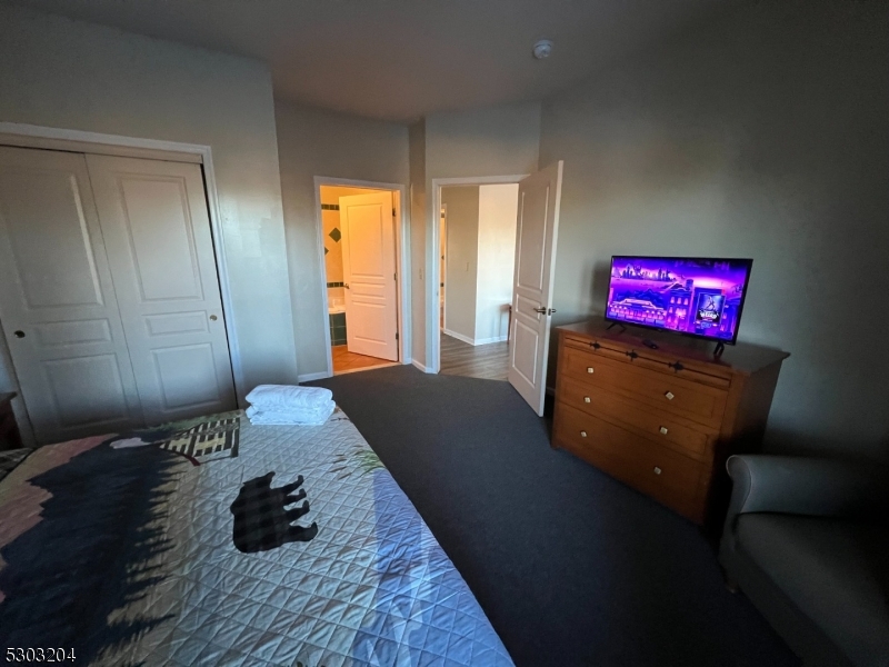7 Maple Crescent, Unit 11 Vernon, NJ 07462 - Photo 22 of 42 a living room with couch and a table