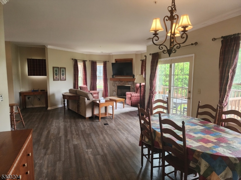 7 Maple Crescent, Unit 11 Vernon, NJ 07462 - Photo 3 of 42 a living room with furniture and a chandelier