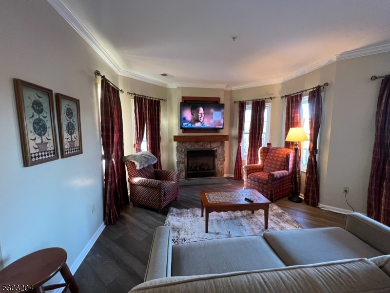 7 Maple Crescent, Unit 11 Vernon, NJ 07462 - Photo 4 of 42 a living room with furniture and a fireplace