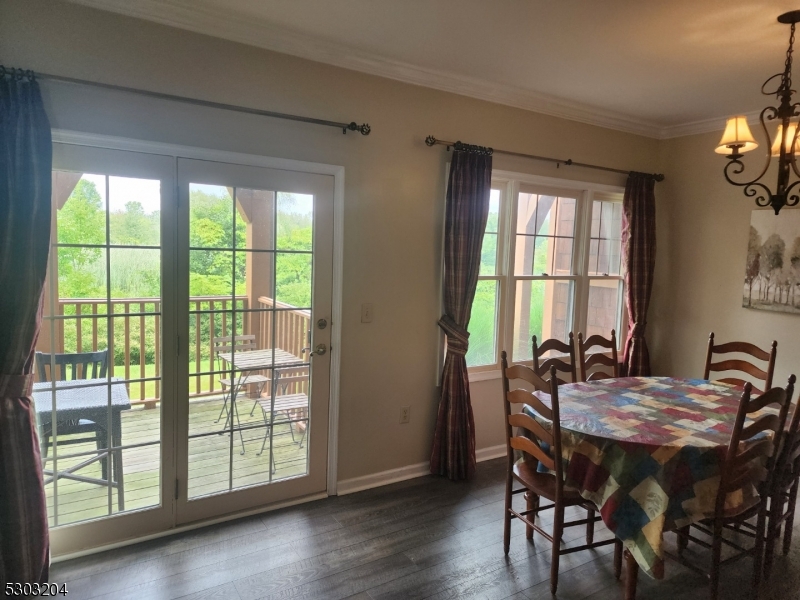 7 Maple Crescent, Unit 11 Vernon, NJ 07462 - Photo 7 of 42 a view of a dining room with furniture and windows