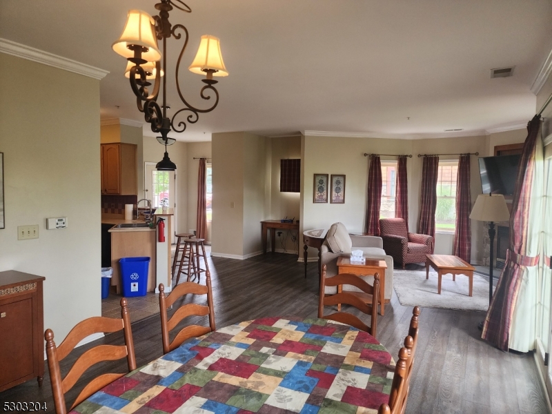 7 Maple Crescent, Unit 11 Vernon, NJ 07462 - Photo 8 of 42 a living room with fireplace furniture and a wooden floor